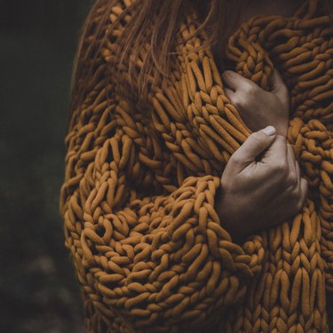 Woman In A Chunky Cardigan In Autumn