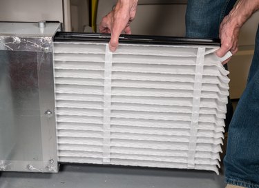 Man removing air filter