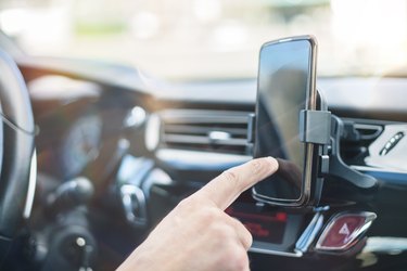 Smartphone clipped to air vent while driving