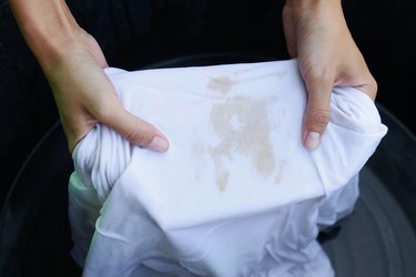 Cropped Hands Of Woman Washing Stained T-Shirt
