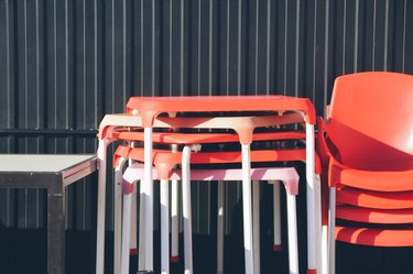 Stacked plastic tables and chairs