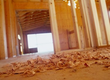 An image of wood shavings on the floor.