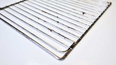 Cleaning oven racks with vinegar and baking soda