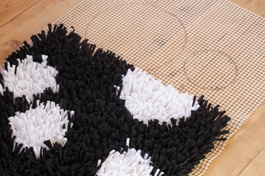 Rug making is a relaxing way to create a beautiful no-waste project. Your friends will be shocked when you tell them that you created this mod, shag rug from old t-shirts.