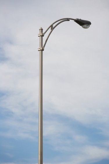 Light pole and cirrostratus clouds