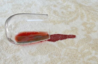 Red wine stain on white carpet