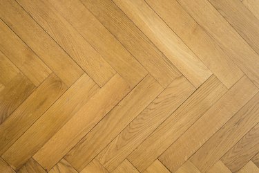 herringbone pattern on old oak parquet hardwood floor