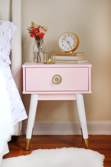 Nightstand painted blush pink with gold dipped legs