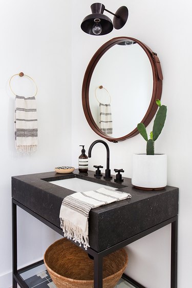 Powder room with focal mirror