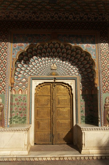 India, Jaipur, City Palace, Peacock Gate decorated arch door surround