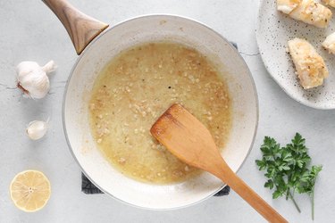 Add butter and garlic to skillet