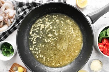 Simmer broth or white wine