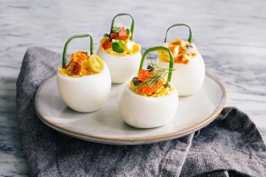 DIY deviled eggs with chive handles and gourmet toppings