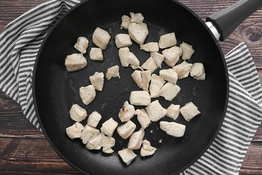 Cook chunks of chicken
