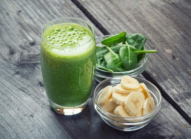 Green fresh healthy smoothie with fruits and vegetables