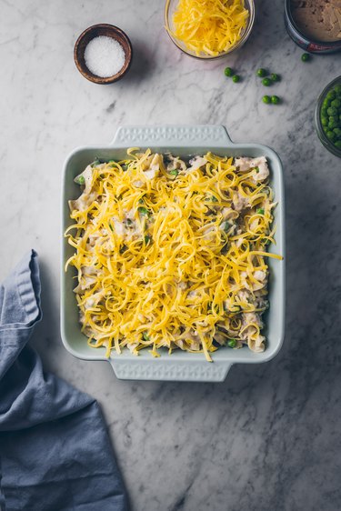 Topping with cheese
