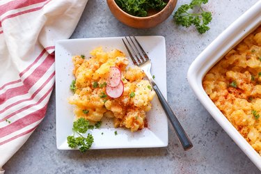 Plate and casserole dish of hashbrown casserole