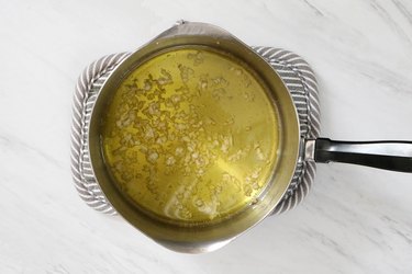 Cook garlic in olive oil