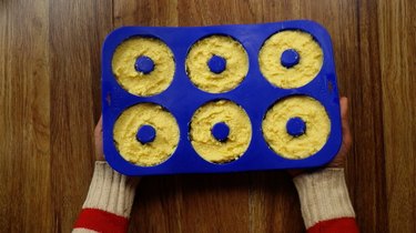 Batter for healthy coconut flour low carb donuts in silicon donut pan.