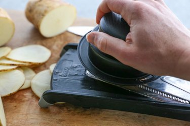 Potato slices and mandolin slicer