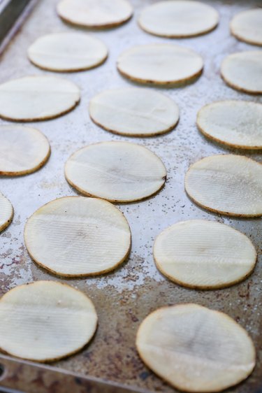 Potato slices on a baking sheet