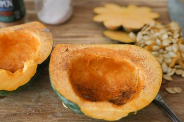 Acorn squash sprinkled with cinnamon and cardamom