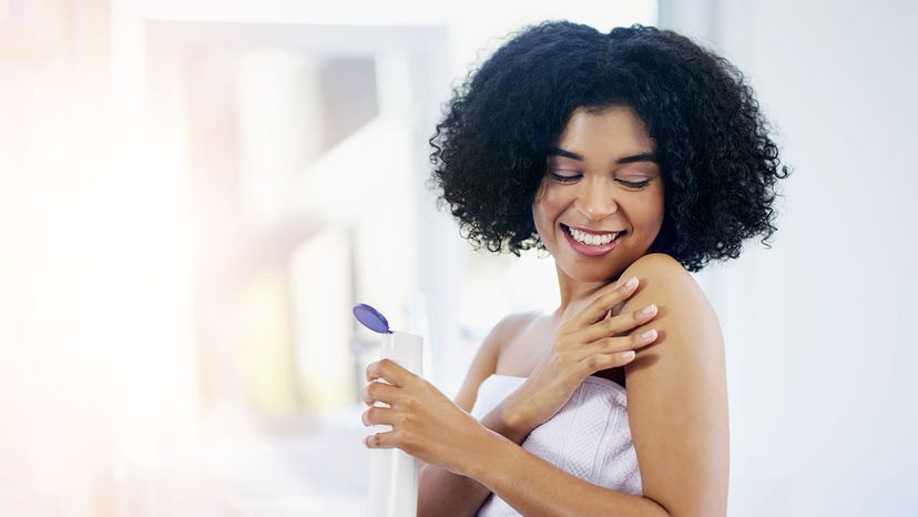 black woman applying lotion