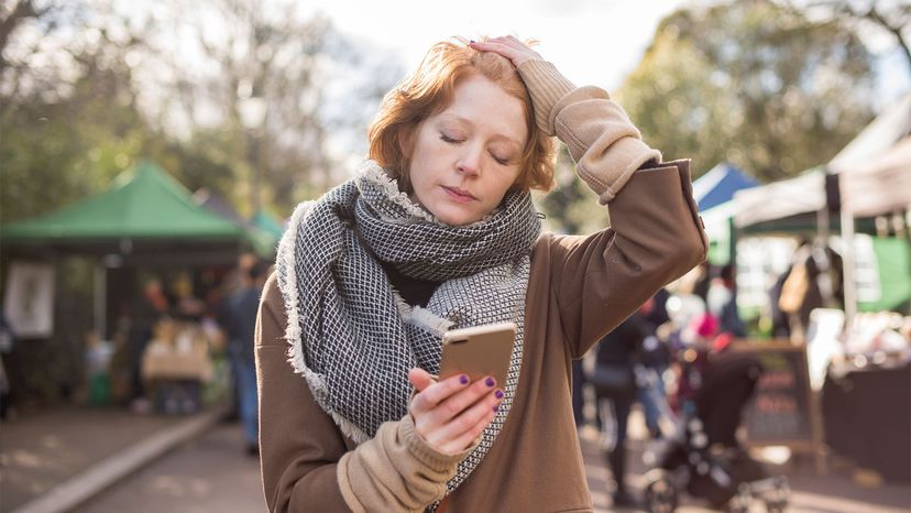 red-haired woman in London looking tired in market