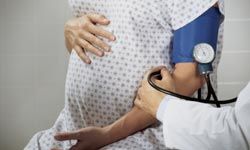 An expectant mother's blood pressure is closely monitored throughout her pregnancy.