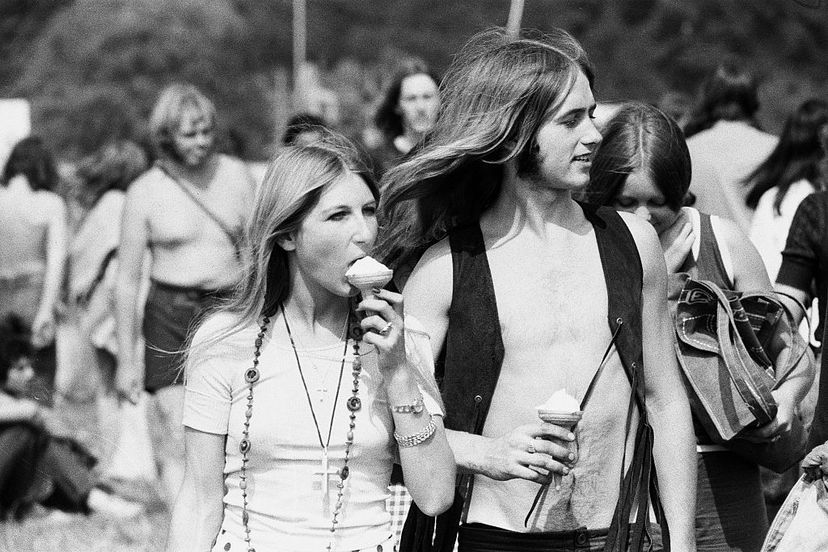 teenagers in a field at music concert