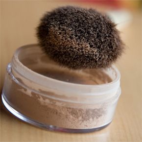 Loose powder of the mineral makeup variety. Someone wisely traded the puff that came with it for a brush. Good move.