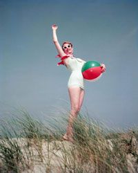 If you're going 1956 retro, ditch the water shoes -- cat eyes, a scarf and the requisite beach ball complete the look.