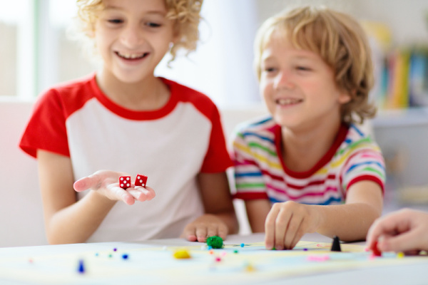 10 Easy Dice Games for Kids | If you're looking for portable travel games and/or need ideas for family game night, these dice games are family friendly and much fun. With options for 2 players as well as games you can play with a large group, we've included a mix of simple DIY dice games and classic store bought games you'll love. These make great camping activities, and are also perfect for road trips and those who need airplane activities for kids. Roll the dice and see what you think!