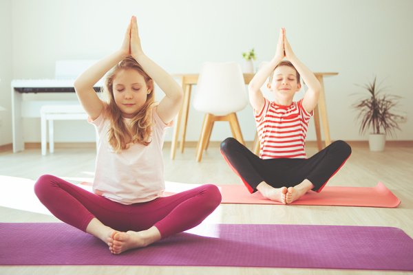 Yoga for Kids | Whether you're looking for yoga poses you can do in the classroom, or kids yoga videos you can stream from home, we're sharing 12 kids yoga poses and videos designed to help little ones stretch and strengthen their bodies, while also allowing them to calm down, relax, focus, and concentrate. You can do these in the garden or at the beach in the summer, as part of your morning and/or bedtime routine to promote sleep, and they make great brain breaks for virtual learning too!